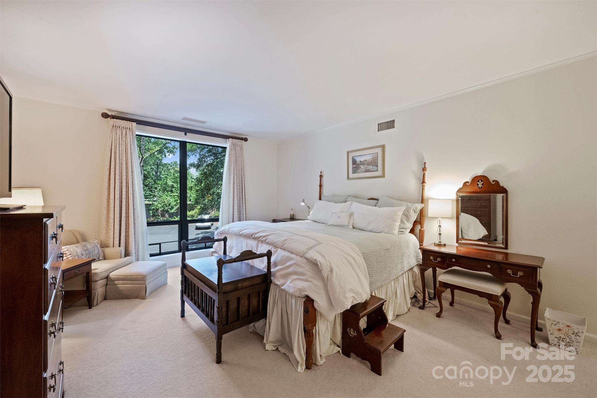 904 Cherokee Road Charlotte, NC 28207 - Photo 22 of 36 a bedroom with a bed and a window