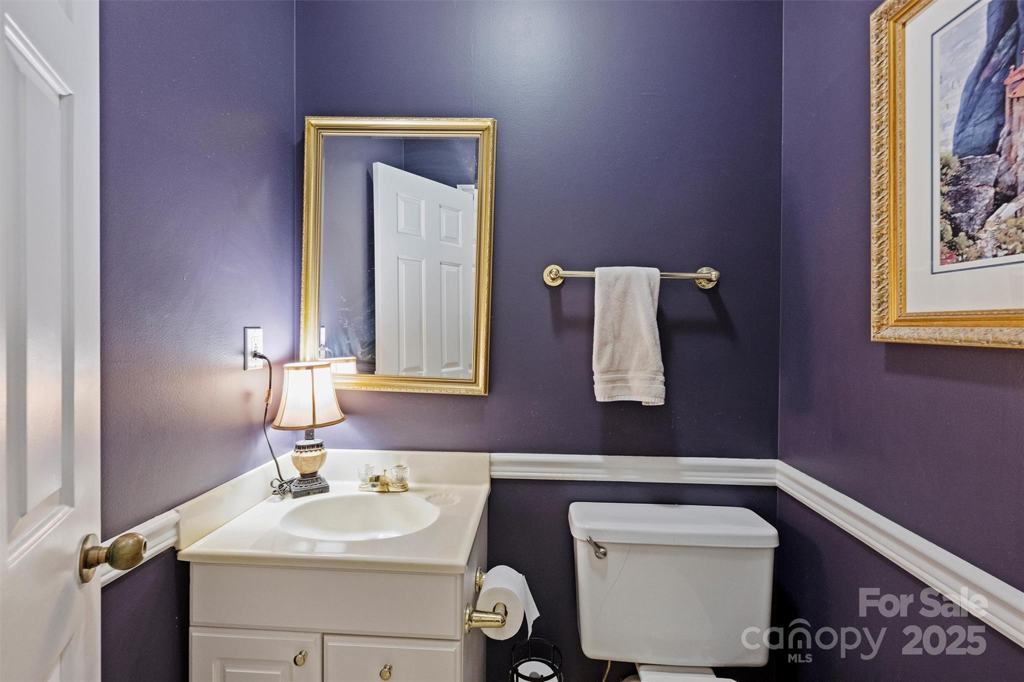 904 Cherokee Road Charlotte, NC 28207 - Photo 29 of 36 a bathroom with a sink vanity and mirror