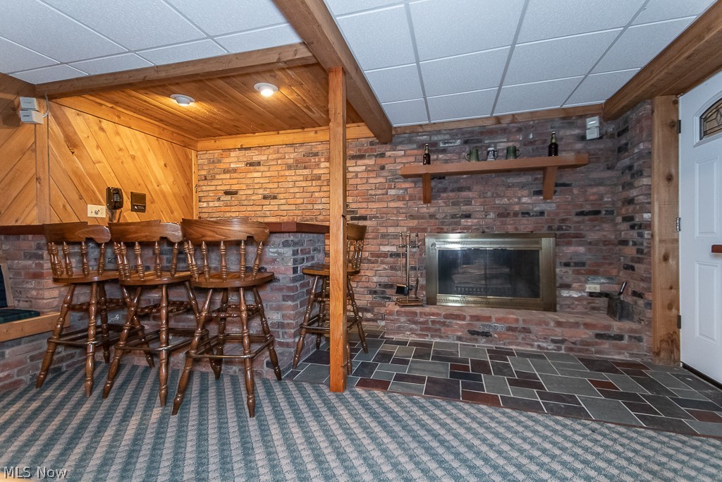 147 Lee Road Painesville, OH 44077 - Photo 12 of 33 wet bar and wood burning fireplace in basement