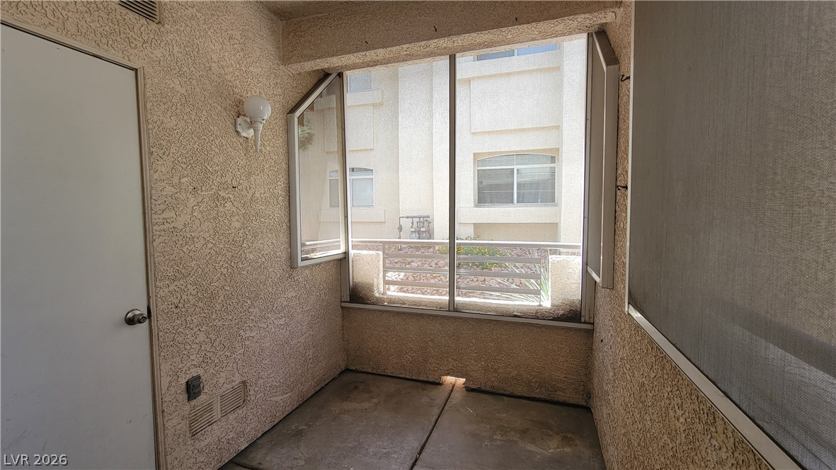 3320 South Fort Apache Road, Unit 111 Las Vegas, NV 89117 - Photo 11 of 12 A private enclosed patio area offers a comfortable outdoor extension to the living space.