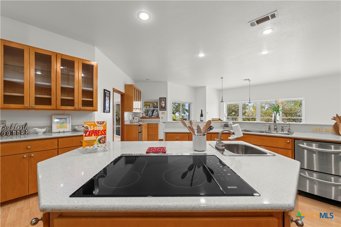 3328 Eagle Ridge Drive Harker Heights, TX 76548 - Photo 11 of 48 a kitchen that has a sink and a stove in it