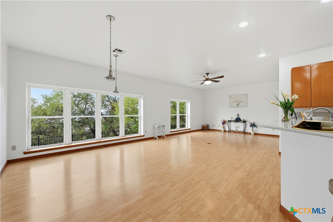 3328 Eagle Ridge Drive Harker Heights, TX 76548 - Photo 17 of 48 a view of an empty room with a window and wooden floor