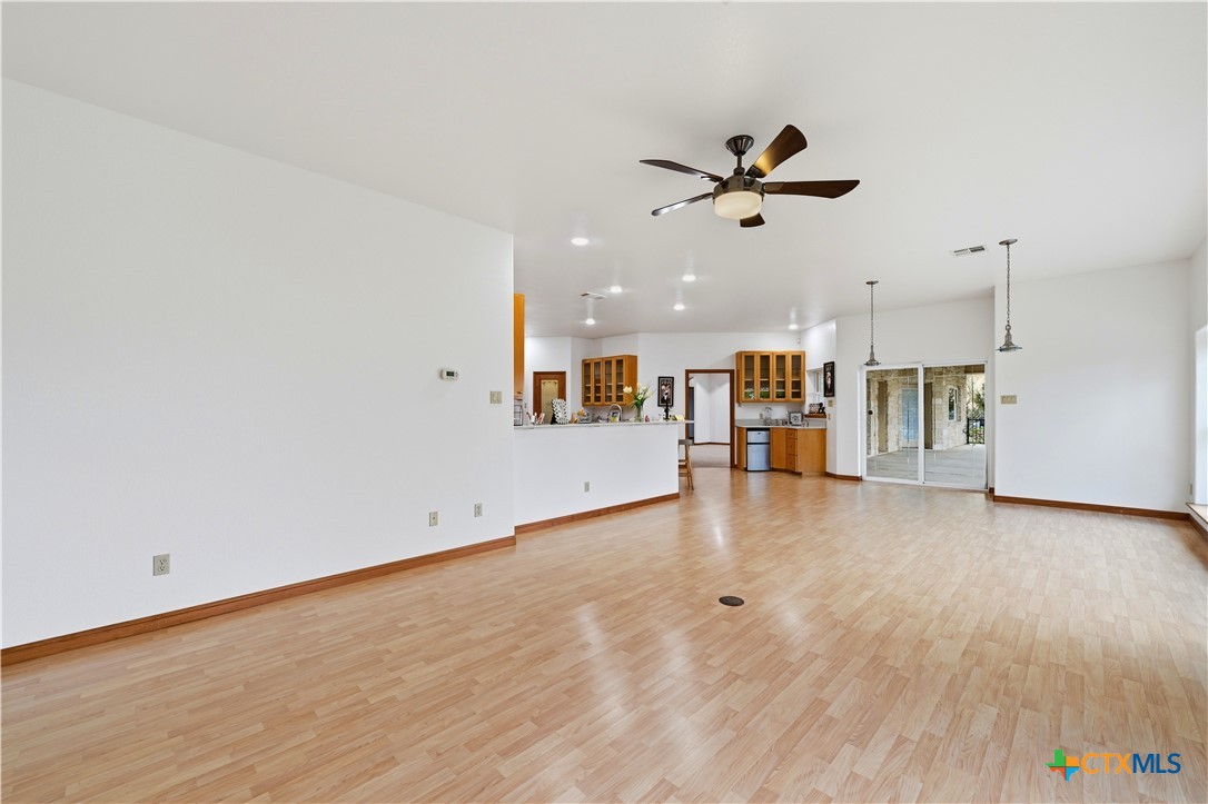 3328 Eagle Ridge Drive Harker Heights, TX 76548 - Photo 18 of 48 a view of a livingroom with a ceiling fan and kitchen space