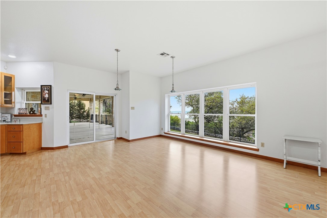 3328 Eagle Ridge Drive Harker Heights, TX 76548 - Photo 19 of 48 a view of an empty room with a window and wooden floor