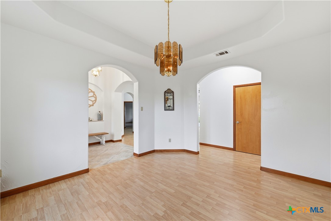 3328 Eagle Ridge Drive Harker Heights, TX 76548 - Photo 21 of 48 a view of a room with wooden floor and ceiling fan