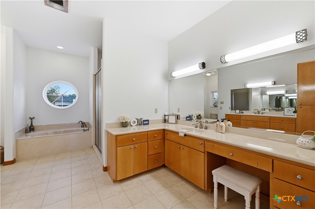 3328 Eagle Ridge Drive Harker Heights, TX 76548 - Photo 26 of 48 a spacious bathroom with a sink double vanity and a mirror