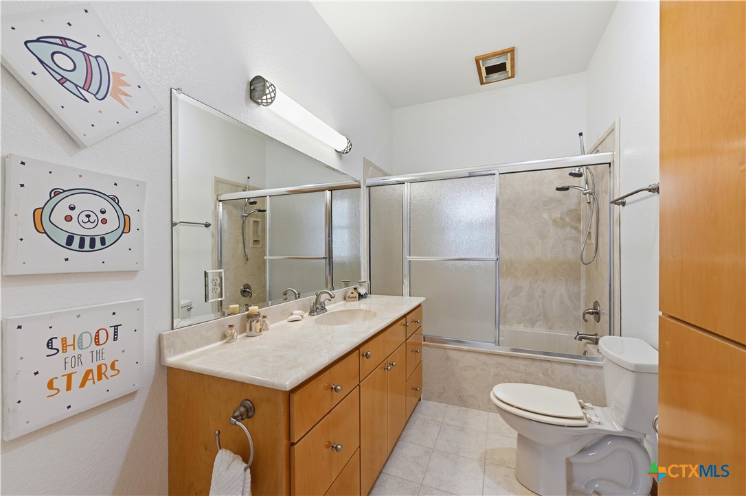 3328 Eagle Ridge Drive Harker Heights, TX 76548 - Photo 30 of 48 a bathroom with a sink a toilet and shower