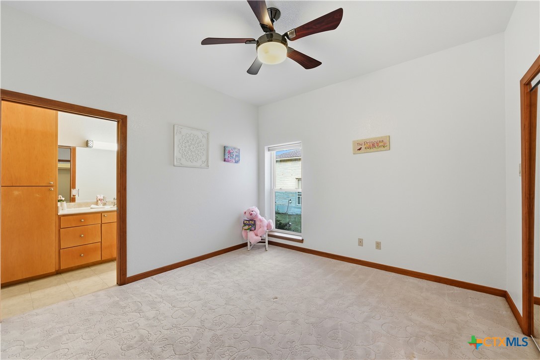 3328 Eagle Ridge Drive Harker Heights, TX 76548 - Photo 31 of 48 an empty room with closet and a ceiling fan