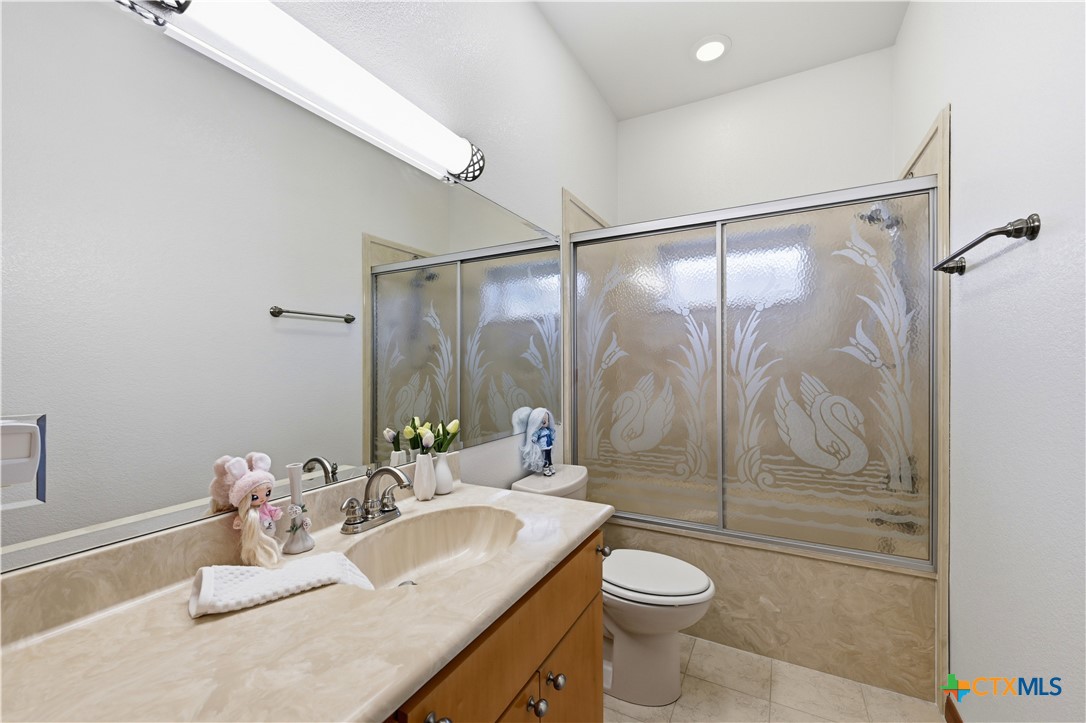 3328 Eagle Ridge Drive Harker Heights, TX 76548 - Photo 32 of 48 a bathroom with a sink toilet and shower