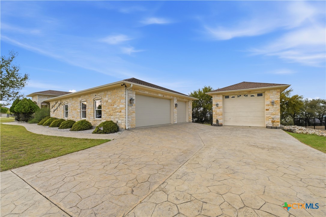 3328 Eagle Ridge Drive Harker Heights, TX 76548 - Photo 45 of 48 a front view of a house with a yard and garage