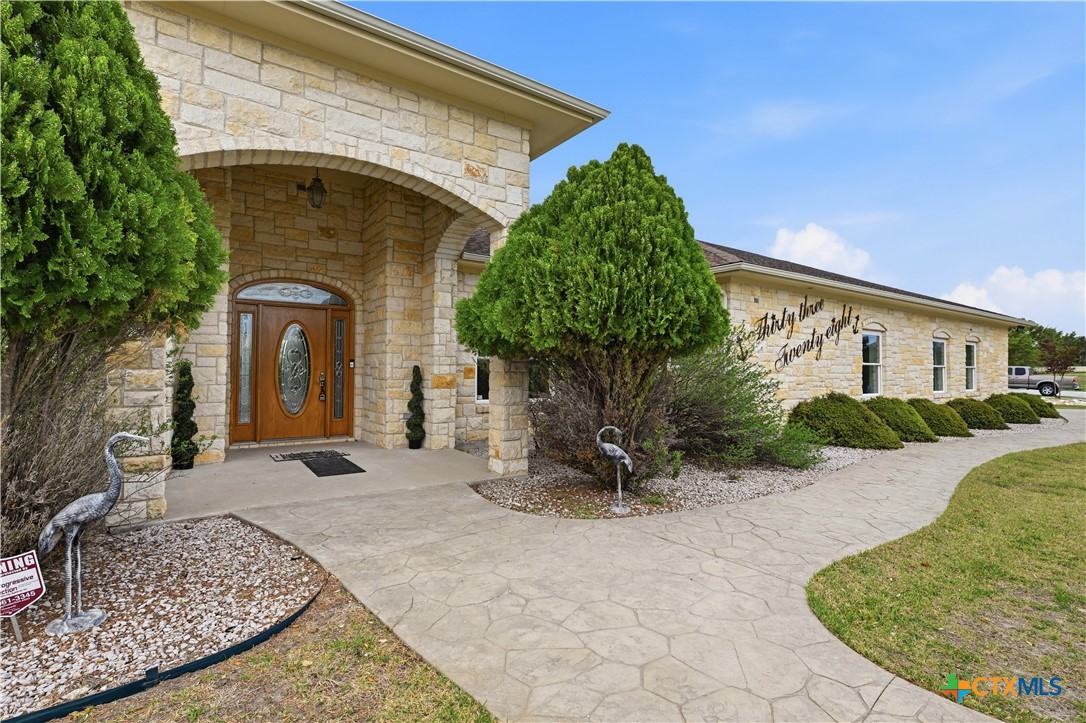 3328 Eagle Ridge Drive Harker Heights, TX 76548 - Photo 5 of 48 a front view of a house with garden