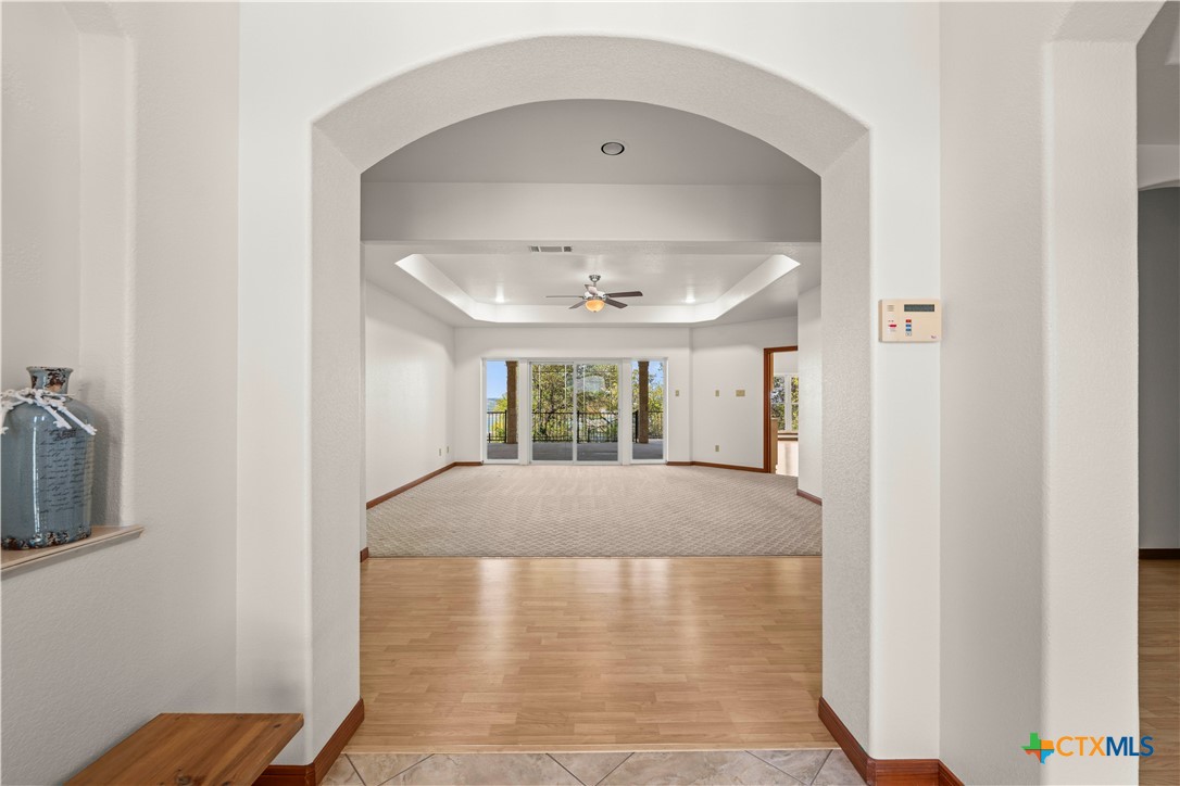 3328 Eagle Ridge Drive Harker Heights, TX 76548 - Photo 7 of 48 a view of a hallway with a window and wooden floor