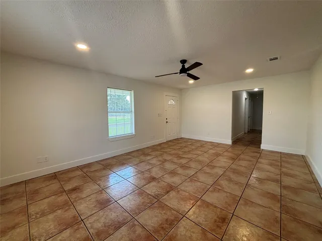 a view of an empty room and window