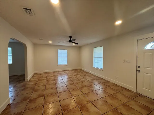 a view of an empty room and window