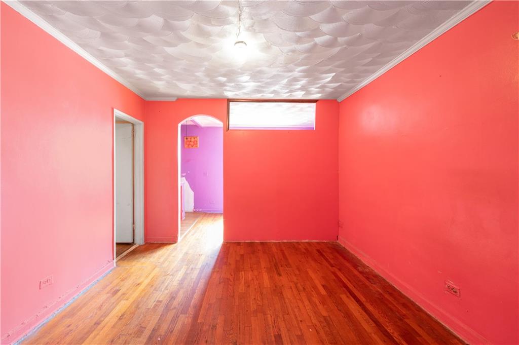 26 Cass Place, Unit 5D Brooklyn, NY 11235 - Photo 6 of 10 a view of a room with wooden floor and a window