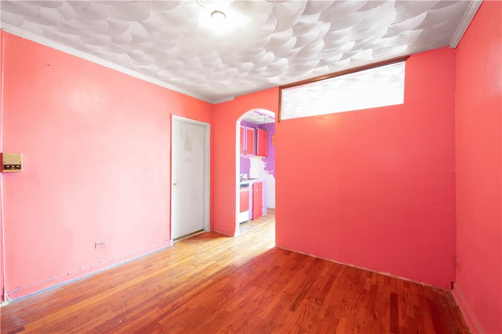 26 Cass Place, Unit 5D Brooklyn, NY 11235 - Photo 7 of 10 a view of empty room with wooden floor and fan