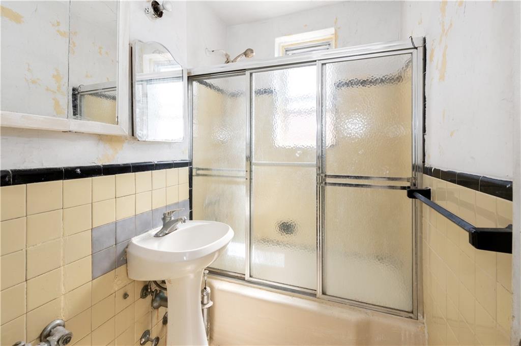 26 Cass Place, Unit 5D Brooklyn, NY 11235 - Photo 10 of 10 a bathroom with a shower and a sink