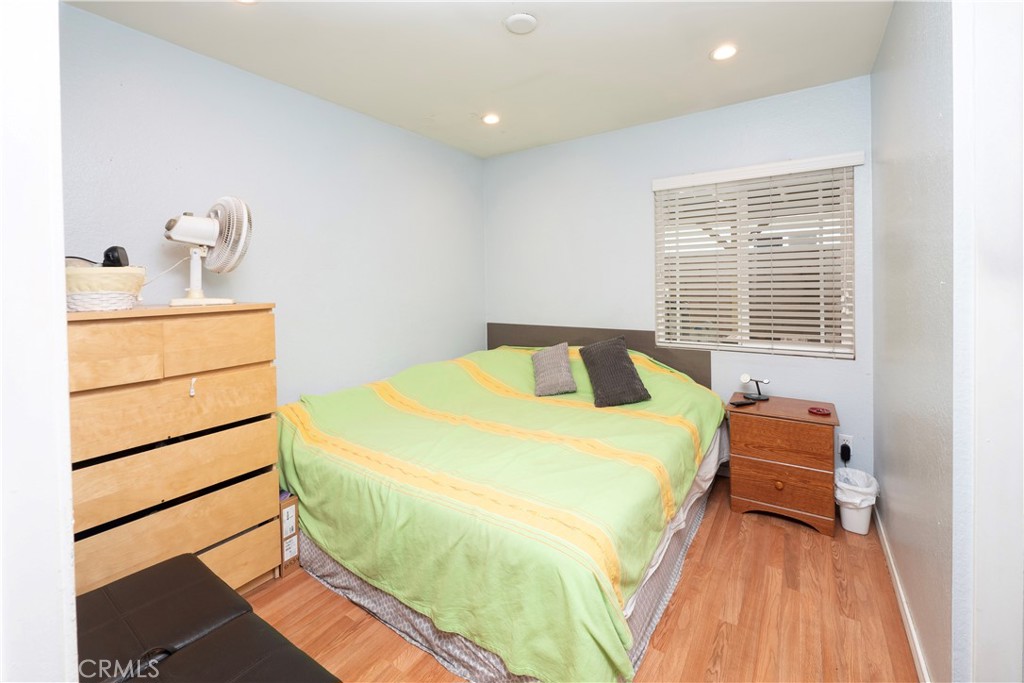 14018 Ridgewood Drive Fontana, CA 92337 - Photo 13 of 30 a bedroom with a bed and a window