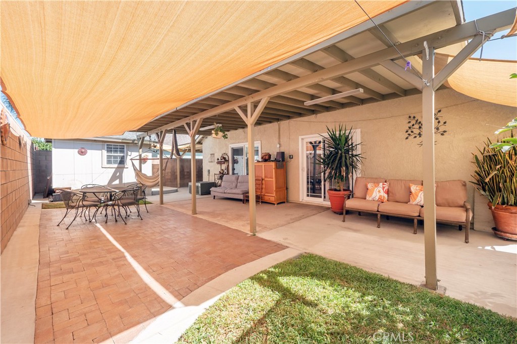 14018 Ridgewood Drive Fontana, CA 92337 - Photo 20 of 30 a view of a patio with a table and chairs