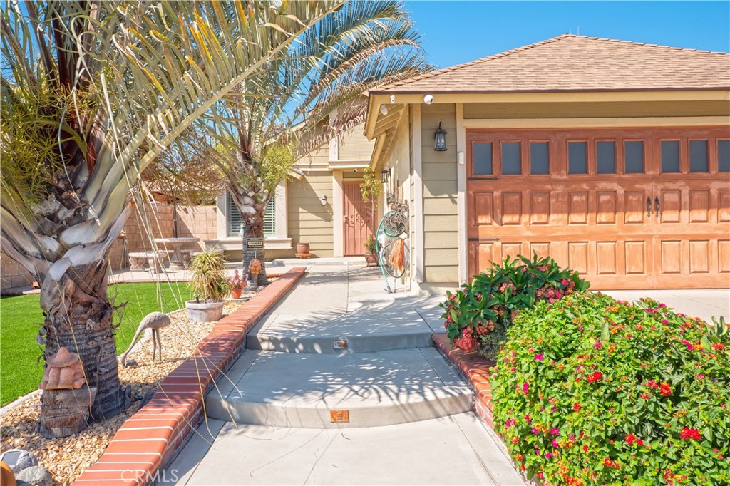 14018 Ridgewood Drive Fontana, CA 92337 - Photo 3 of 30 a view of a house with a yard and fountain in middle