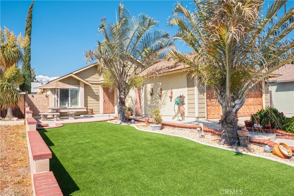 14018 Ridgewood Drive Fontana, CA 92337 - Photo 4 of 30 a view of a house with backyard porch and sitting area