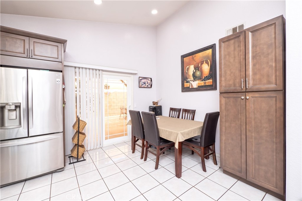 14018 Ridgewood Drive Fontana, CA 92337 - Photo 8 of 30 a view of a dining room with furniture window and refrigerator