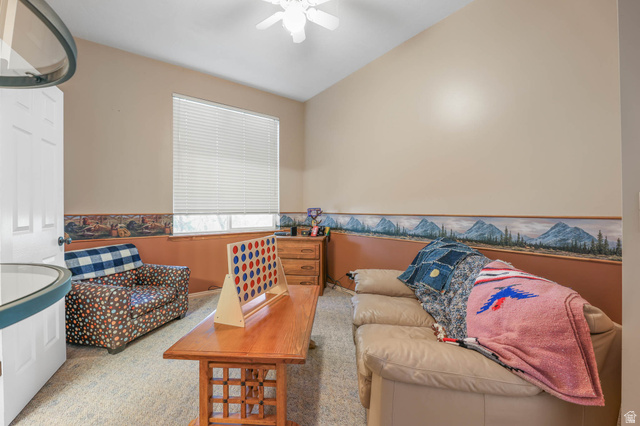569 Elk Meadow Loop Tooele, UT 84074 - Photo 34 of 56 Sitting room with ceiling fan and a wainscoted wall