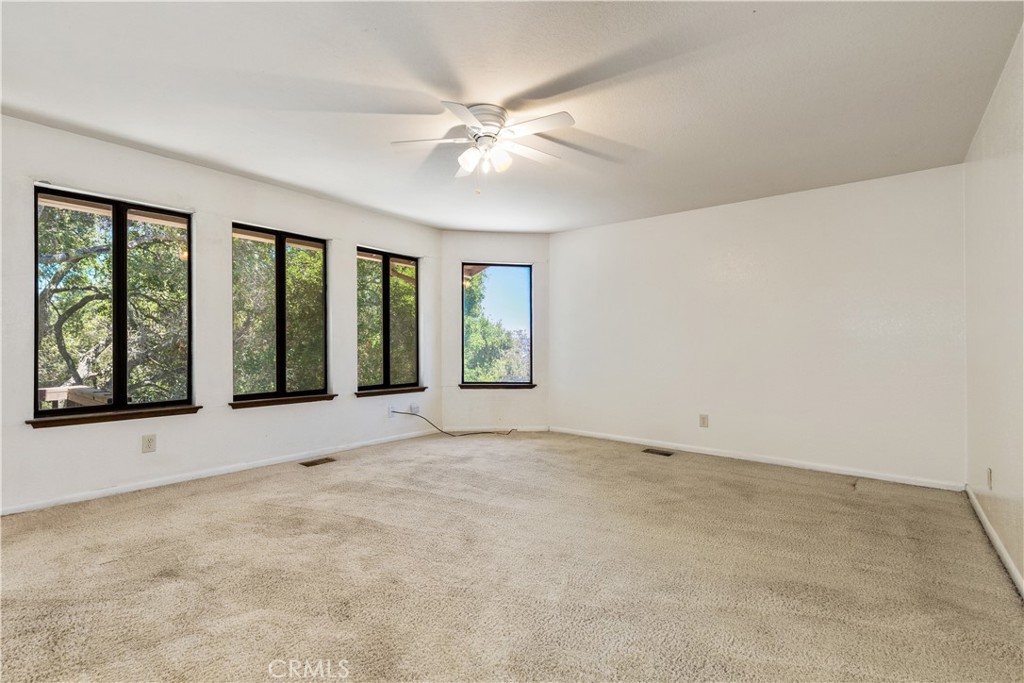 7905 San Gregorio Road Atascadero, CA 93422 - Photo 13 of 40 Primary bedroom with lots of windows to let in the view.
