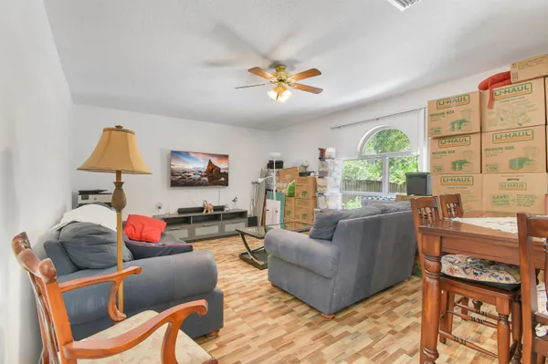 a living room with furniture and a large window