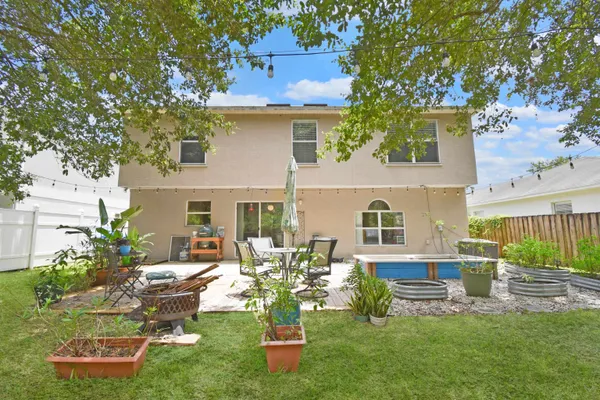 a front view of house with yard and seating area