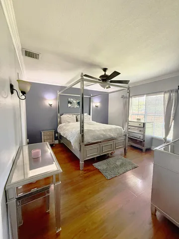 a bedroom with a bed and a view of bedroom