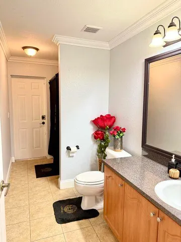 a bath room with a toilet and a shower