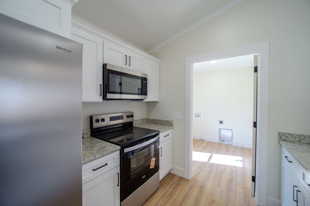 478 Hickory Lane Sparta, TN 38583 - Photo 14 of 43 a kitchen with a stove and a microwave