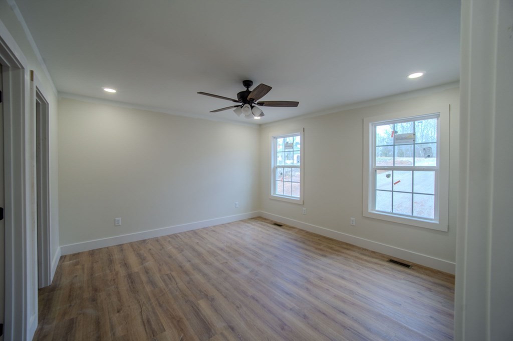 478 Hickory Lane Sparta, TN 38583 - Photo 17 of 43 an empty room with wooden floor and windows