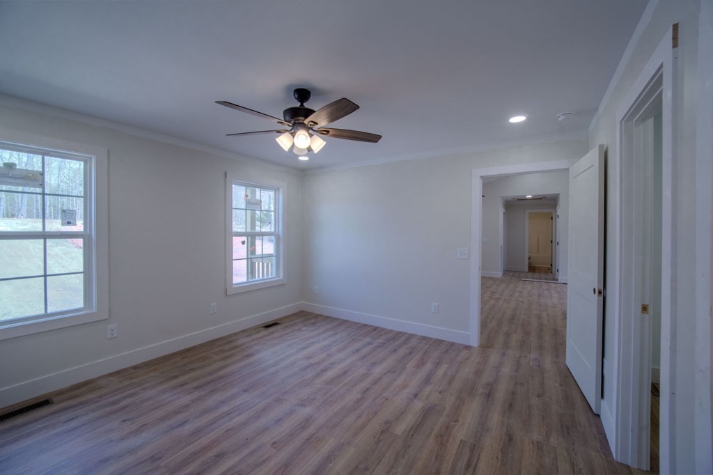 478 Hickory Lane Sparta, TN 38583 - Photo 19 of 43 a view of an empty room with a window and wooden floor