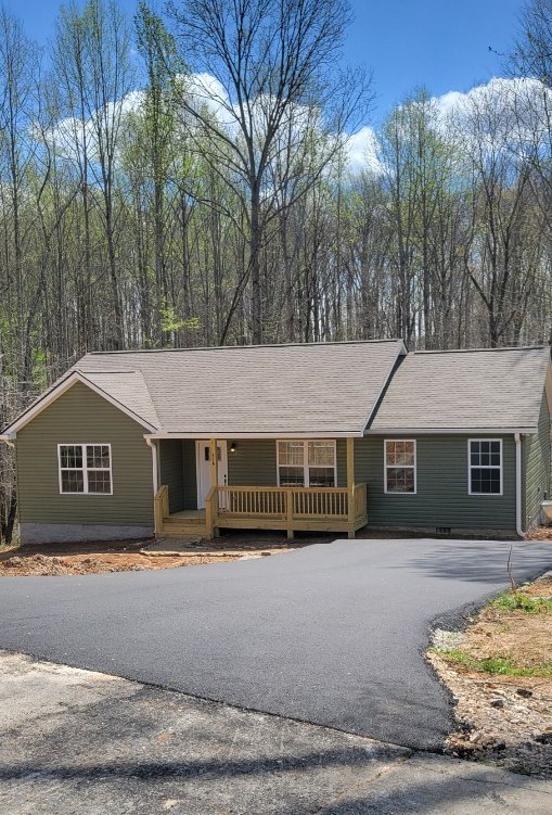 478 Hickory Lane Sparta, TN 38583 - Photo 2 of 43 a house that has a tree in front of it