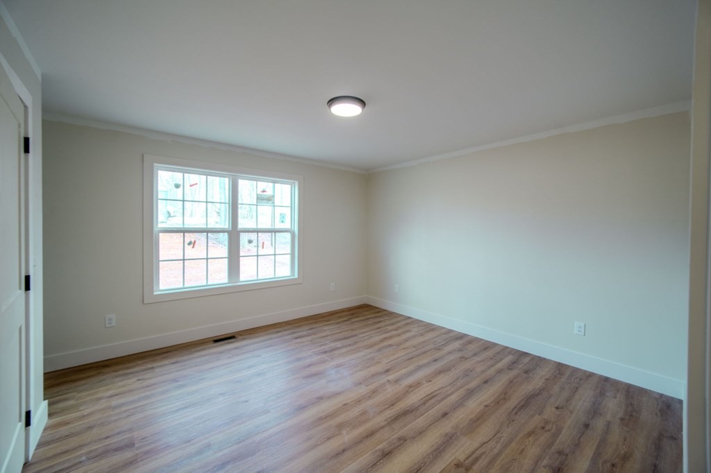 478 Hickory Lane Sparta, TN 38583 - Photo 24 of 43 an empty room with wooden floor and windows