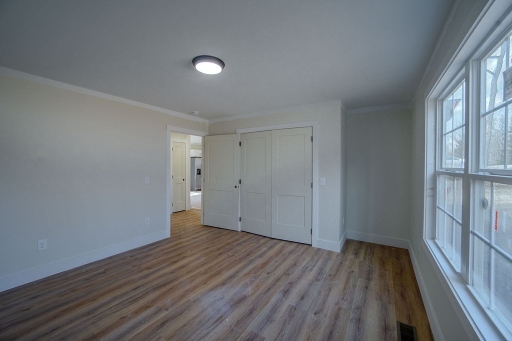 478 Hickory Lane Sparta, TN 38583 - Photo 26 of 43 a view of an empty room with wooden floor and a window
