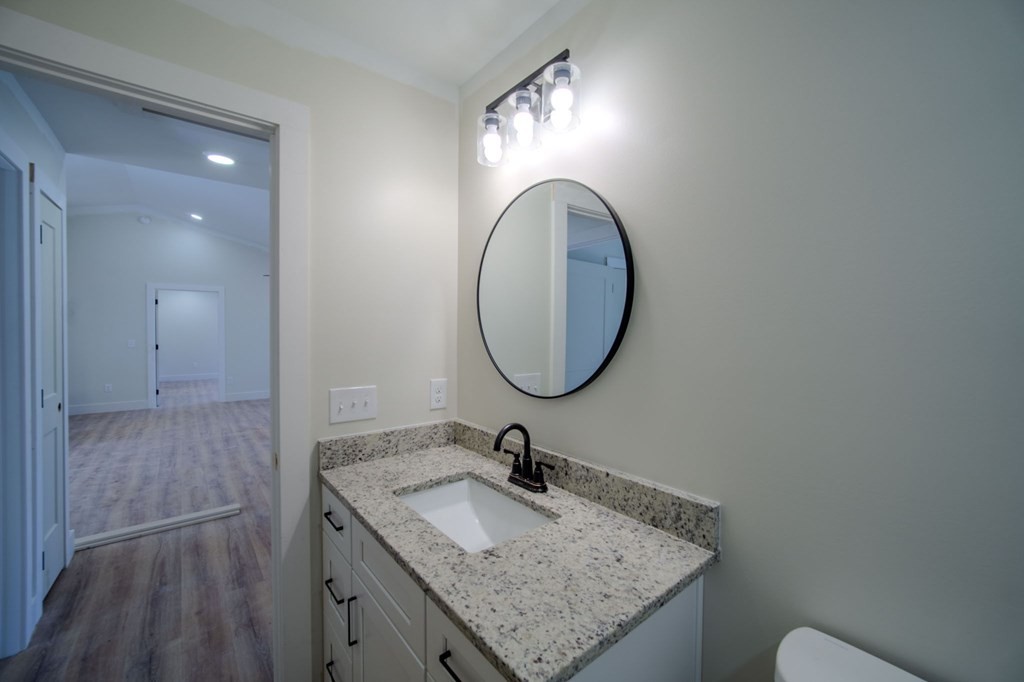478 Hickory Lane Sparta, TN 38583 - Photo 32 of 43 a bathroom with a granite countertop sink and a mirror