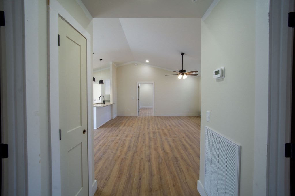 478 Hickory Lane Sparta, TN 38583 - Photo 33 of 43 a view of a hallway with wooden floor and a bathroom