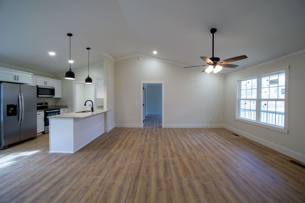 478 Hickory Lane Sparta, TN 38583 - Photo 7 of 43 a view of kitchen with refrigerator microwave and stove