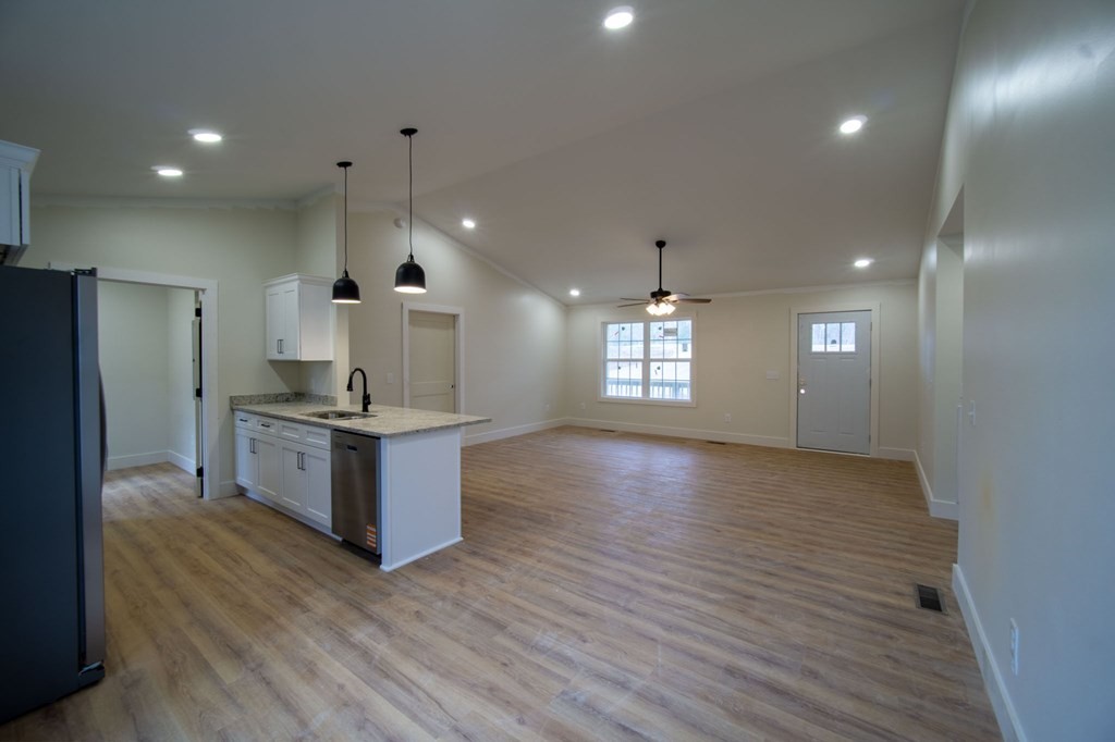 478 Hickory Lane Sparta, TN 38583 - Photo 10 of 43 a large kitchen with stainless steel appliances granite countertop a large counter top a sink and a refrigerator