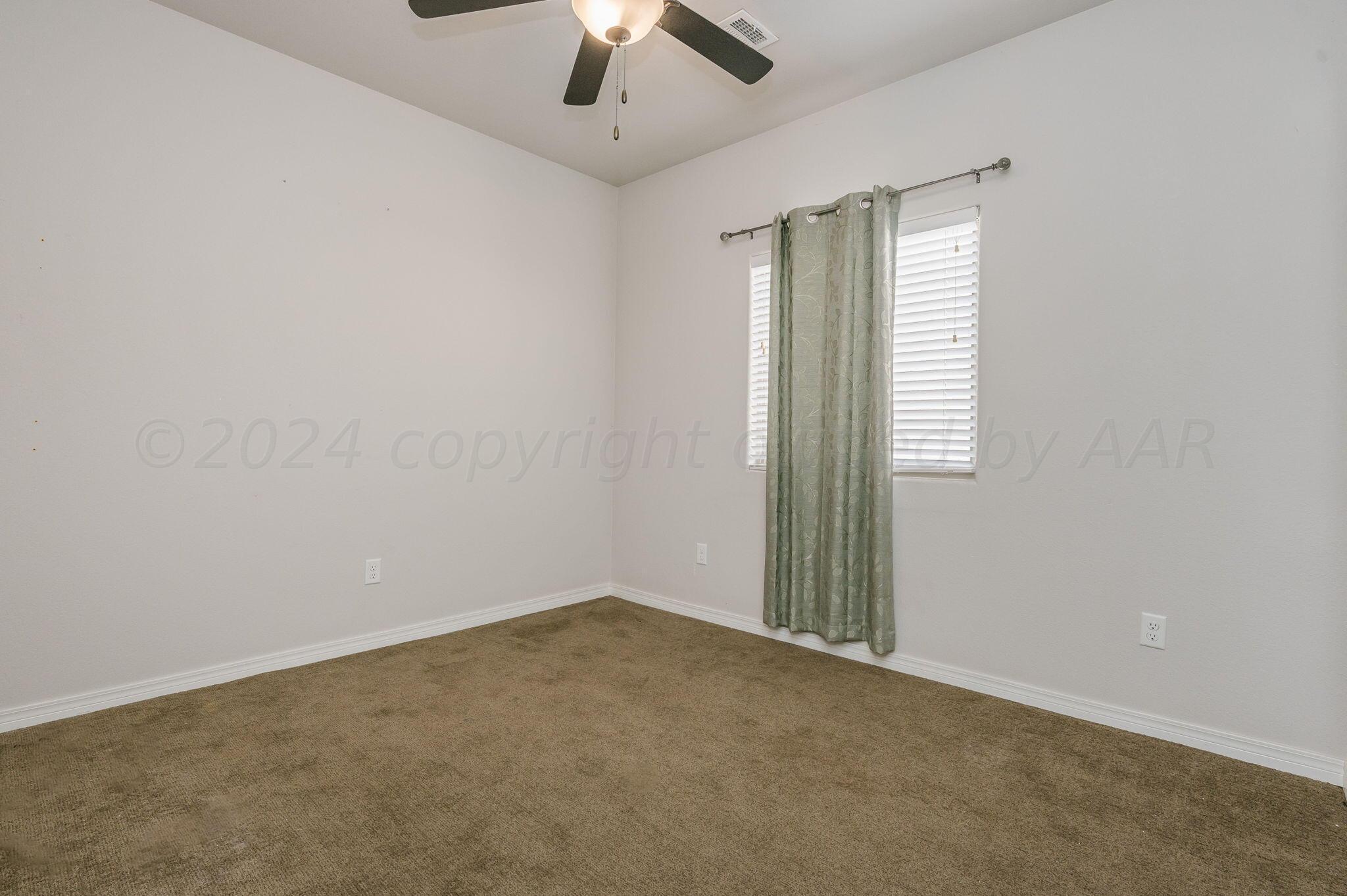 1201 Cabernet Way Amarillo, TX 79124 - Photo 12 of 18 an empty room with a empty space and a ceiling fan