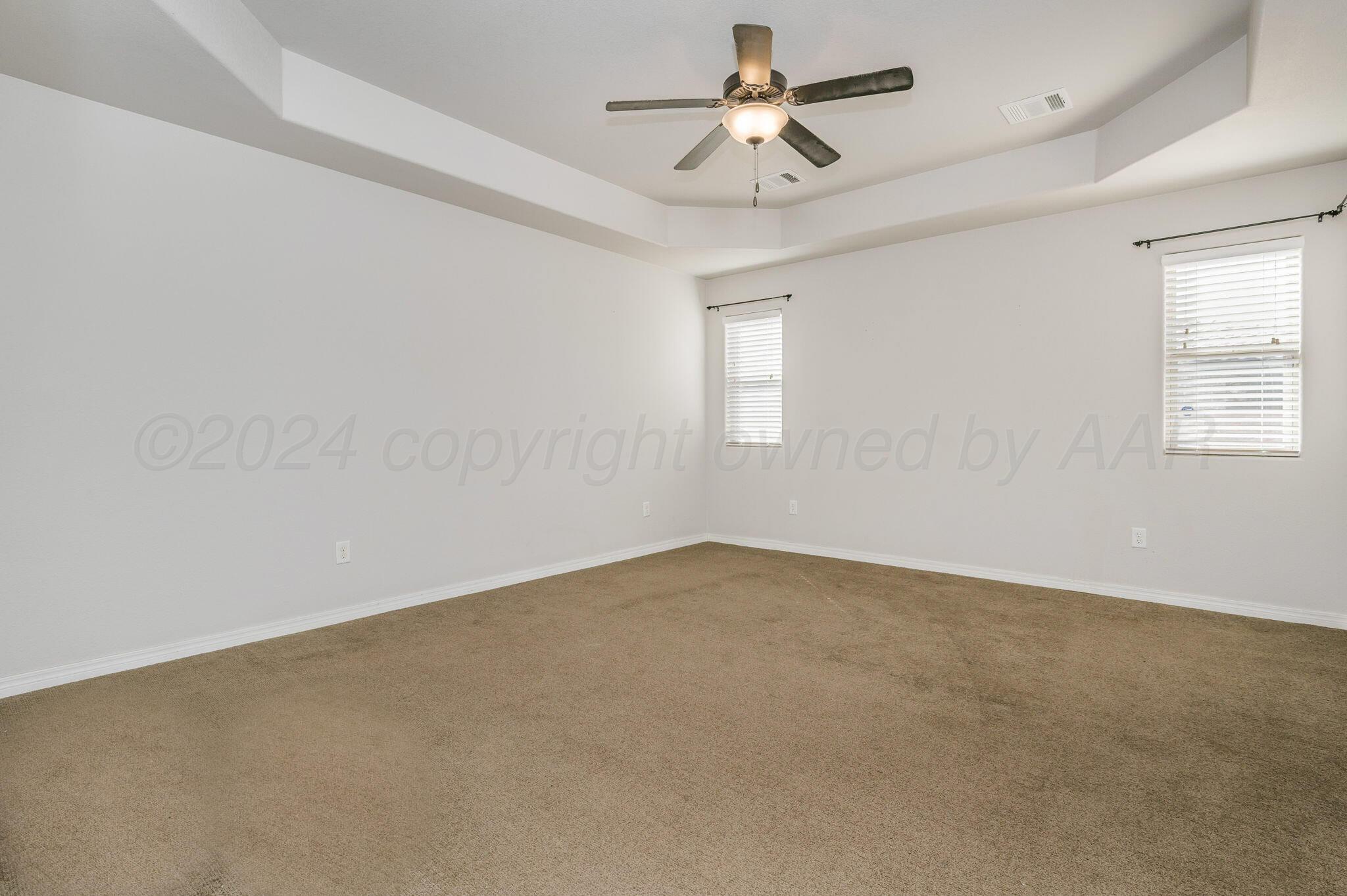 1201 Cabernet Way Amarillo, TX 79124 - Photo 14 of 18 an empty room with windows and fan