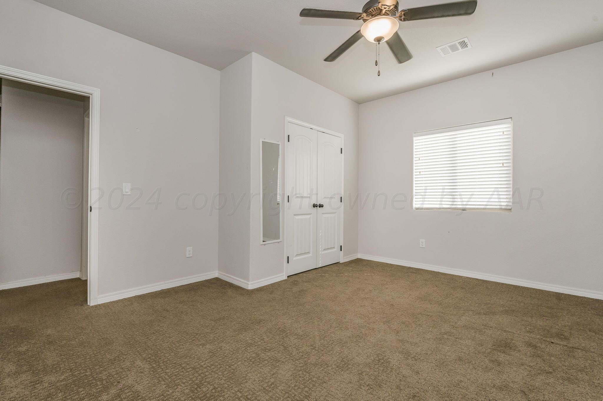 1201 Cabernet Way Amarillo, TX 79124 - Photo 7 of 18 a view of an empty room with a window
