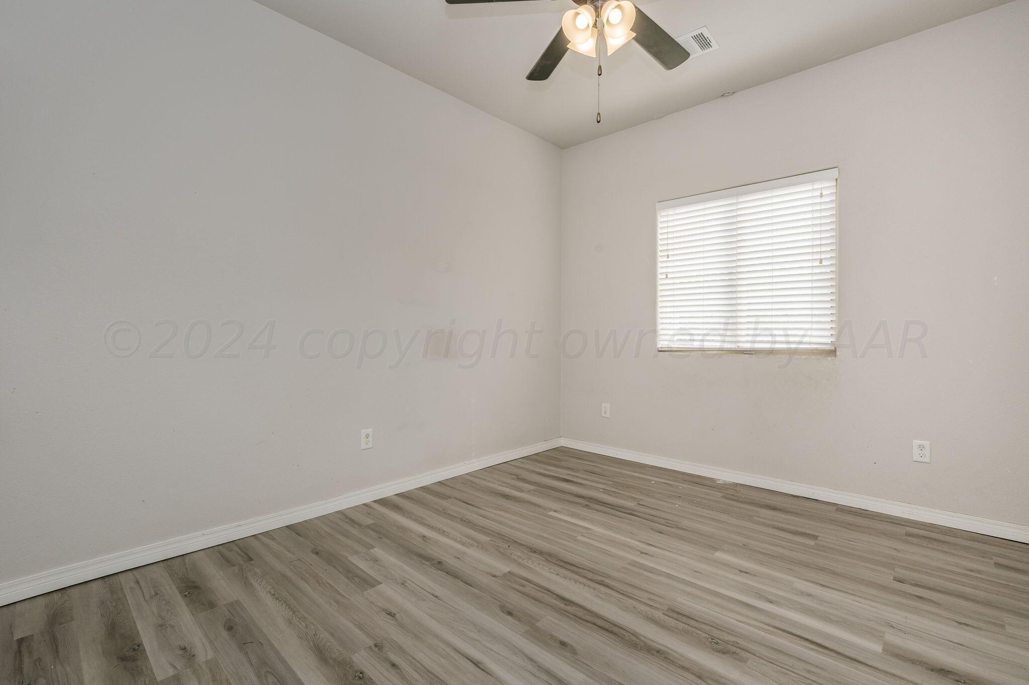 1201 Cabernet Way Amarillo, TX 79124 - Photo 9 of 18 an empty room with a window