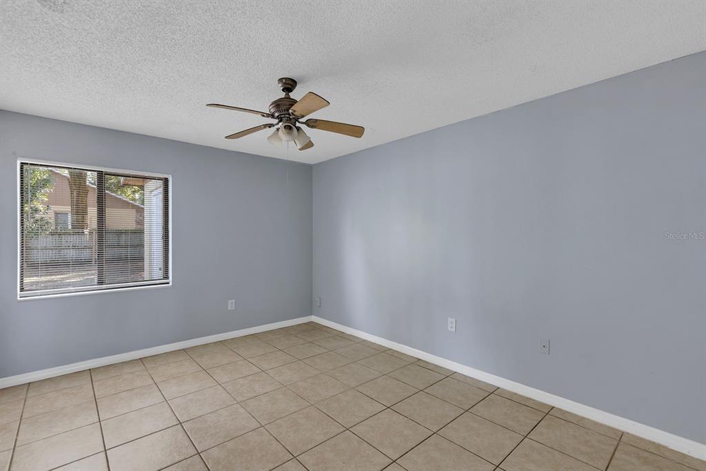 3701 Spring Land Drive Orlando, FL 32818 - Photo 11 of 21 a view of empty room with windows