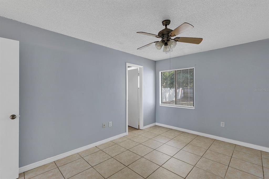 3701 Spring Land Drive Orlando, FL 32818 - Photo 15 of 21 a view of a ceiling fan and window