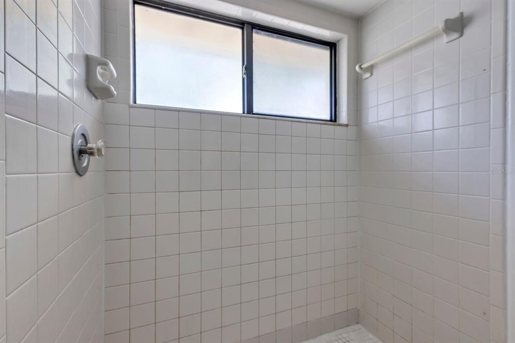 3701 Spring Land Drive Orlando, FL 32818 - Photo 17 of 21 a bathroom with a shower