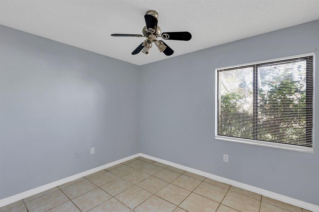3701 Spring Land Drive Orlando, FL 32818 - Photo 8 of 21 a view of an empty room with a window